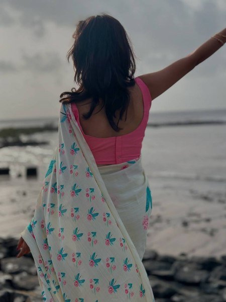 soft white japan satin saree with green leaf floral design lightweight and elegant Silk Sarees Wholesale